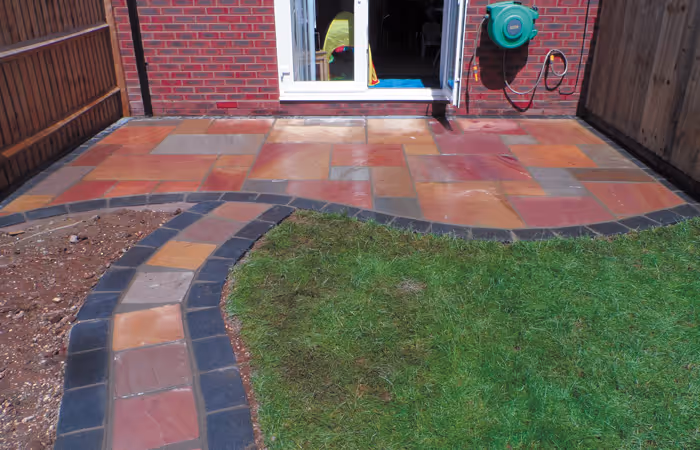 Circular block-paved patio with lawn