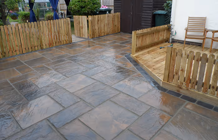 Sandstone patio and timber deck with seating